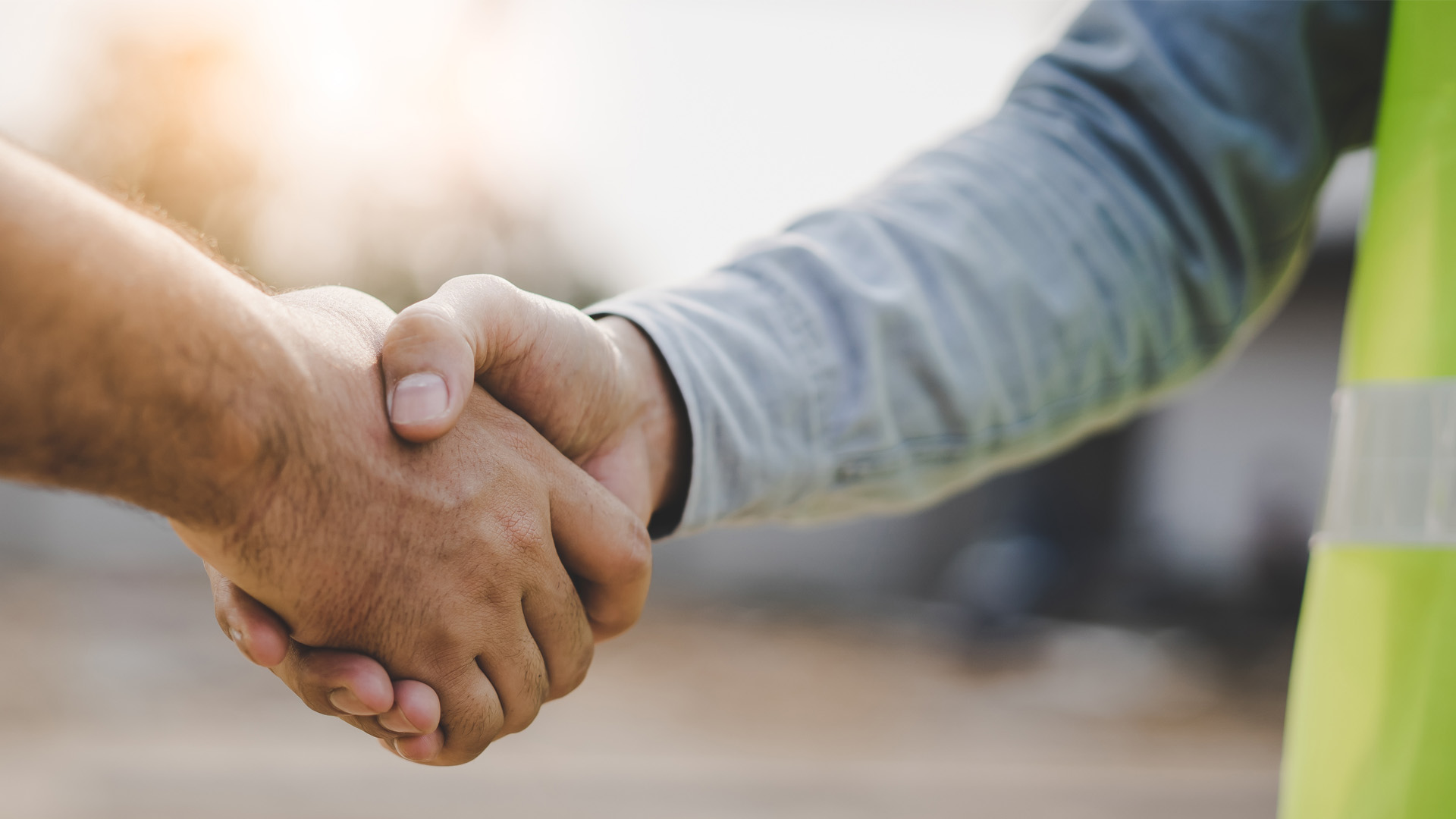 Unified Disposal Partners Employee Shaking Hands with Customer